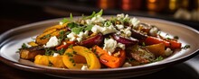An Appetizing Closeup Of A Plate Featuring A Medley Of Roasted Root Vegetables, Including Vibrant Orange Carrots, Tender Pars, And Golden Beets, Perfectly Caramelized And Served Alongside