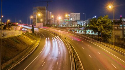 Wall Mural - Long exposure time-lapse of street traffic near Campolide station in the evening with car lights trails. Lisbon, Portugal. Zoom in effect