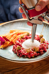 Canvas Print - beef tartare with carrot and cheese