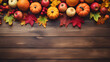 Thanksgiving background with Apples, pumpkins and autumn leaves on wooden background. Halloween, Thanksgiving day or seasonal background