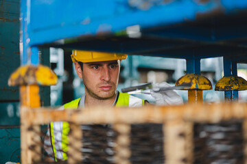 professional technician engineer with safety helmet hard hat working in industrial manufacturing factory, men at work to checking equipment of machinery production technology or construction operating