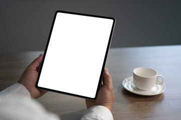 Digital tablet computer close up man using tablet hands man multitasking with isolated screen