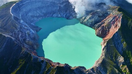 Wall Mural - Aerial view of Kawah Ijen volcano with turquoise sulfur water lake at sunrise.Amazing nature landscape view at East Java, Indonesia. Natural landscape background