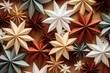 paper star decorations in earth tone colors flat lay for your festive Christmas project
