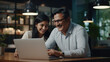 © PRASANNAPIX - Senior businessman and his female assistant laughing while looking in laptop