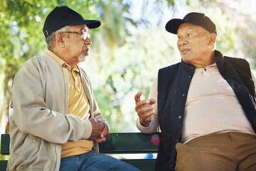 Poster - Elderly men, park and communication with friendship, nature and conversation with bonding on bench. Diversity, closeup and old people with community for socialize, relaxation and discussion on life