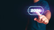© Shutter2U - Man hand toching the 2024 abstract cyberpunk technology interface by poinitng finger on isolated black background with copy space. Happy New Year 2023 to 2024 concept. Innovation and hitech theme.