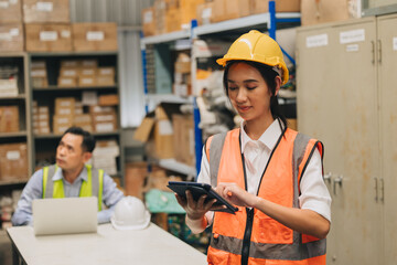 Engineer woman work in hardware products warehouse store using tablet parts inventory management software