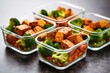 vegan meal prep containers with tofu and veggies