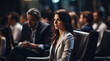 © hakule - The audience is listening attentively, and the camera focuses on a woman's face