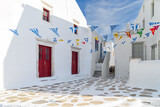 Fototapeta Uliczki - Typical street scene in Mykonos Town one of the Cyclades islands in Greece
