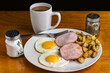 canadian bacon  with fried eggs  and home fries