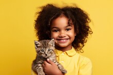 A Cute Little Girl Cuddles Her Adorable Kitten, Their Friendship Radiating Love And Happiness In A Cozy Home.