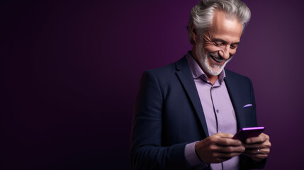 Poster - An elderly man smiling and laughing with his phone against a colored background.