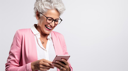 Poster - An elderly woman smiling and laughing with her phone against a colored background.