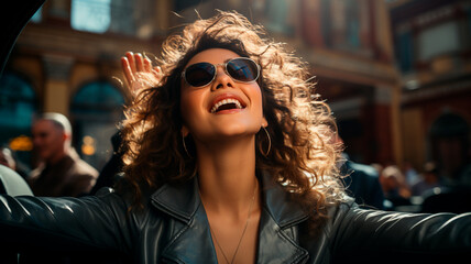 Wall Mural - young woman in a car with glasses and hat.