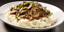 A Delightful Image Highlighting Creamy, Goldenhued Mashed Potatoes As The Base, Topped With Succulent Strips Of Beef Drenched In A Decadent, Yet Balanced, Creamy Mushroom Sauce.