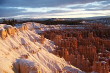 Slopes Of Bryce Canyon Early In The Morning After A Snowstorm. Winter Sunrise At Bryce Canyon National Park, Utah, USA
