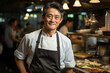 Happy Chef asian man of a Big Restaurant  in a Modern Kitchen. 