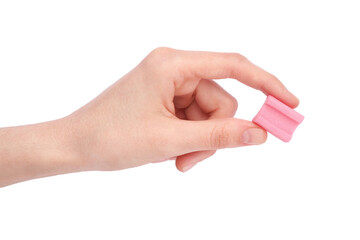 Canvas Print - Woman holding tasty pink chewing gum on white background, top view