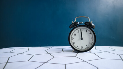 alarm clock on blue background