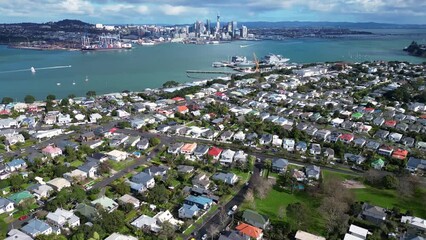 Wall Mural - Auckland, New Zealand: Aerial drone footage of Auckland CBD skyline view from the Davenport fancy residential neighborhood in New Zealand largest city. 