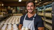 An attractive man holding a dairy product in a smiling portrait.