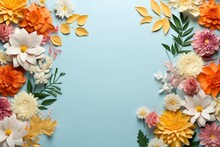 Creative Layout Made Of Flowers And Leaves On A Left And Right Border. Top View Pattern Of Yellow Flowers And Blank Copy Space In The Center. Light Blue Background.