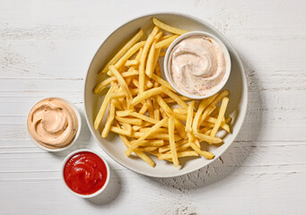 Canvas Print - french fries with various dip sauces