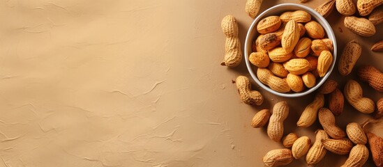 Poster - Peanuts in a brown bowl on a isolated pastel background Copy space used for making oil and peanut butter Ideal for healthy nutrition Idea of condiments
