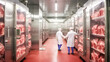 A meat industry workers packs meat in refrigerator. Chilled storage holding meat for creating dishes.

