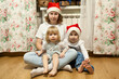 Teenage girl with two little sisters, New Year holiday