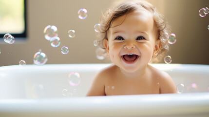 Happy cute baby in a bath with foam and soap bubbles , healthcare for young children.