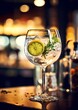 Gourmet cocktail of gin and tonic garnished with a slice of lemon and a sprig of rosemary on a bar with a blurred restaurant bar background. Generated AI