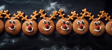 Christmas Saint Nicholas Food Bakery Bake Baking Photography Background - Closeup Of Reindeer Rudolph Cookies With Santa Claus Hat On Black Concrete Table, Top View