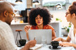 © (JLco) Julia Amaral - Group of people brainstorming ideas over coffee in a cafe