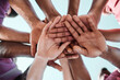 © Talia Mdlungu/peopleimages.com - People, teamwork and hands together in collaboration, goals or community for motivation below. Closeup of group piling in team building, solidarity or trust in support for sports, rugby or match