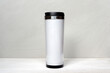 White thermo tumbler mockup on white gray background. Cup for design
