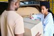 African American woman manager makes inventory of things being deposited