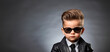 Children in a classic black suit. Business concept