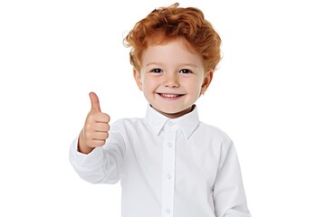 Wall Mural - A little boy wearing a white shirt giving a thumbs up gesture. This image can be used to convey positivity, approval, or success in various contexts.