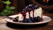 Piece of cheesecake with black currant and blueberry sauce on white plate on wooden table