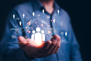 Customer Relationship Management and global business concept, Businessman show global structure customer network technology icon in hand digital marketing and human business development.