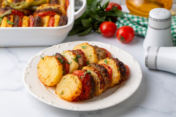 Wall Mural - Traditional Turkish food; baked potatoes and meatballs. Turkish name; kofteli patates dizmesi, patates dizme