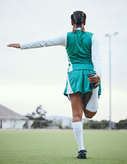 Sticker - Back, sports and a woman hockey player stretching for the start of a game or competition outdoor. Balance, fitness and warm up with the legs of an athlete getting ready for training on a field