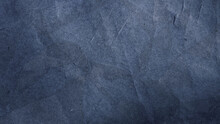 Black Dark Blue Texture Background For Design. Toned Rough Concrete Surface. A Painted Old Paper. Wide Banner.