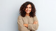 © JKLoma - Young Brazilian woman cross arms isolated background looking to the side and smiling