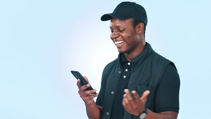 Wall Mural - Smile, typing and black man with a smartphone, funny and connection on a blue studio background. African person, guy and model with a cellphone, humor and digital app with social media and laughing