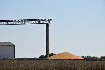 Sticker - Pile of Harvested Corn by a Grain Tower