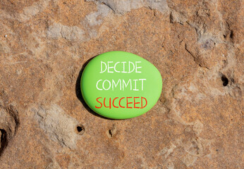 Wall Mural - Decide commit succeed symbol. Concept word Decide Commit Succeed on beautiful big green stone. Beautiful brown stone background. Business decide commit succeed concept. Copy space.